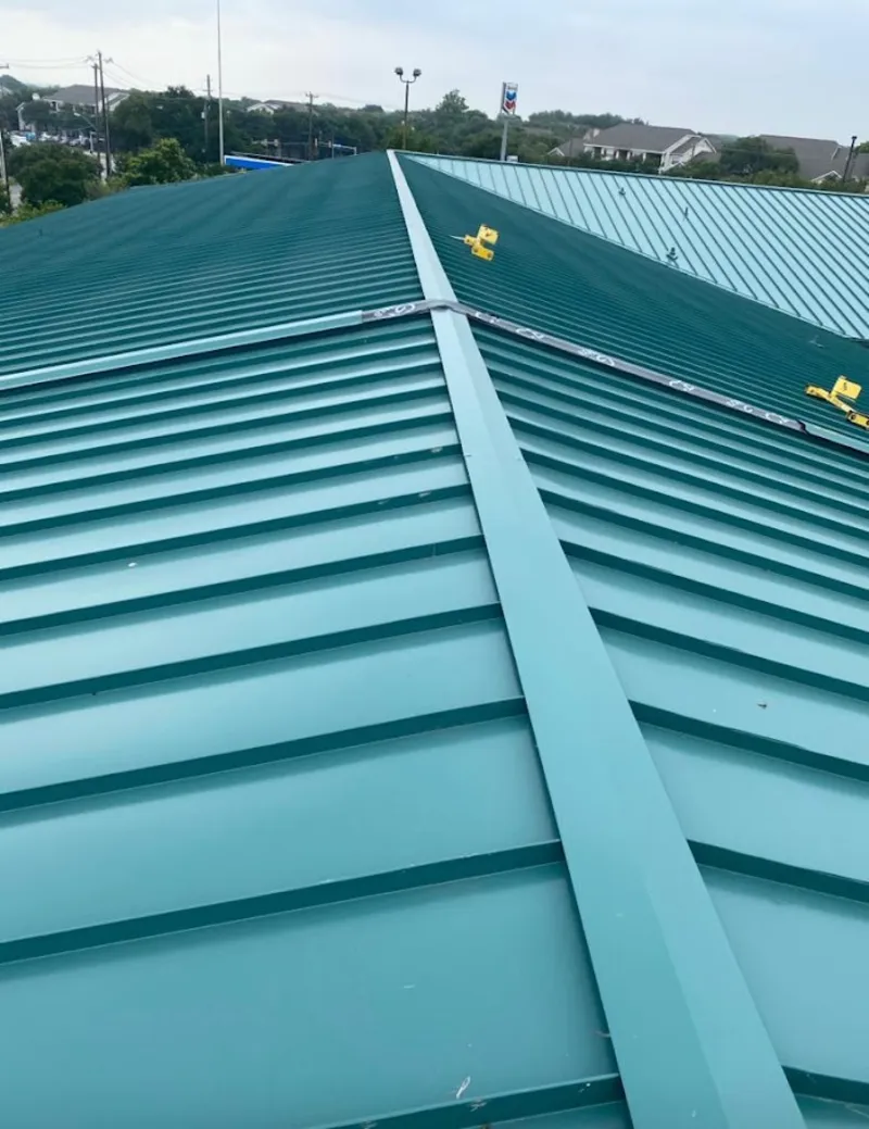 Green commercial metal roof ridge and valley for Metal Roof Repair in Forest Park